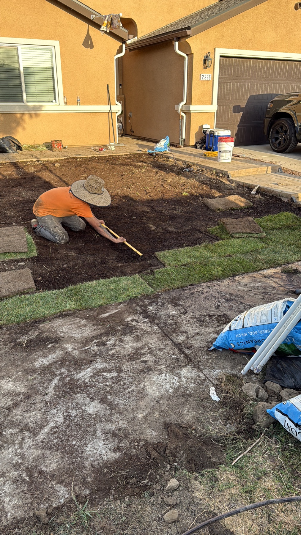 Leveling new top soil for new sod in Delano